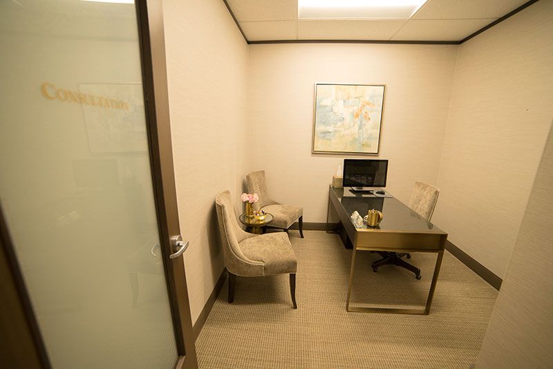 Modern office consultation room with two chairs.
