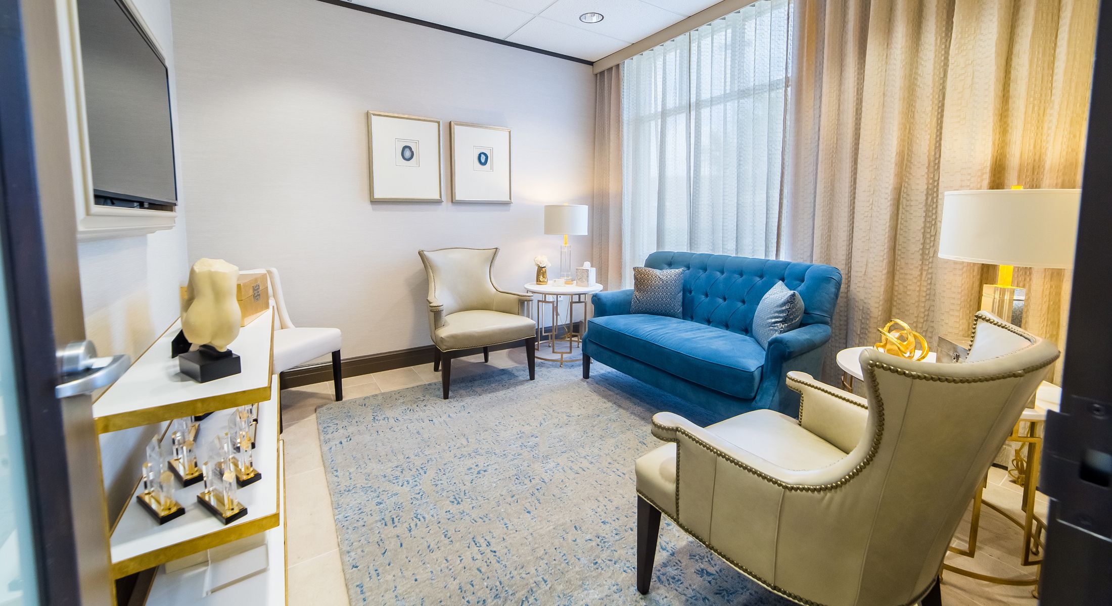 Stylish waiting room with modern furniture and decor.