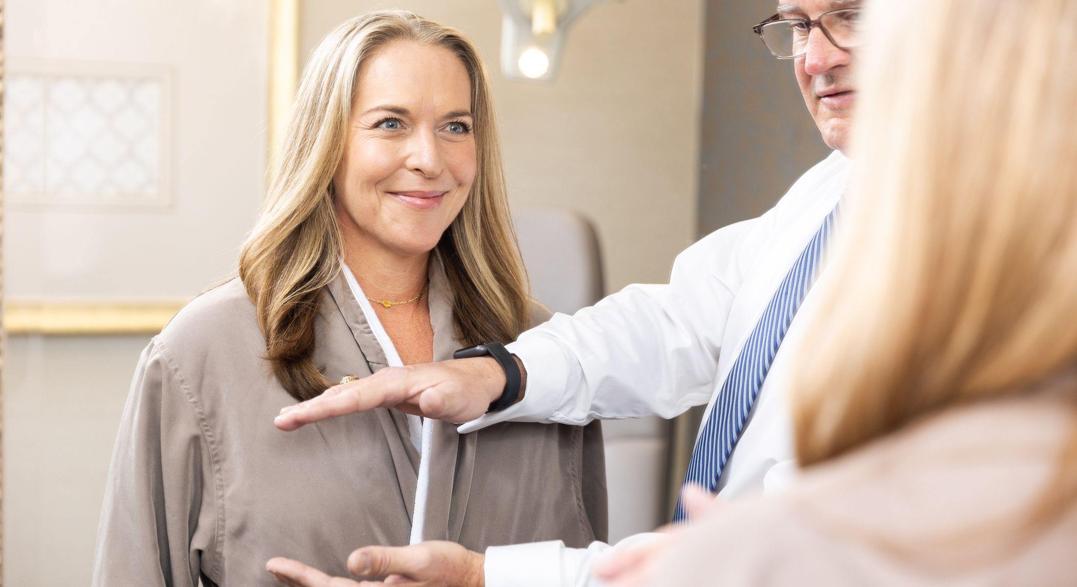 Woman smiling during a fitting consultation.